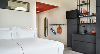 Interior view of the accessible Catbird studio featuring a king bed.