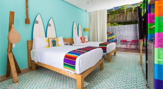 Image of a single bed in a Deluxe Ocean-View Room.