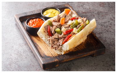 Beef sandwich on a wood tray